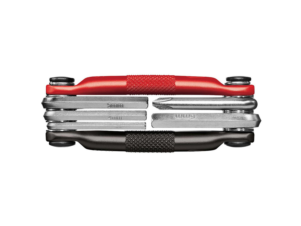 Multifunktionelt Crankbrothers M5 værktøj med 5 forskellige værktøjer til cykelreparation, herunder skruetrækkere og unbrakonøgler, i kompakt design.