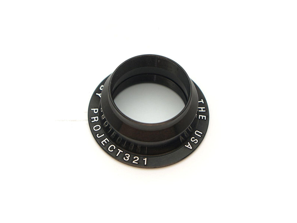 Crankbrothers Bearing Tension Nut i sort, designet til at sikre og justere hjulens bevægelse på cykler, med en holdbar konstruktion for optimal ydeevne.