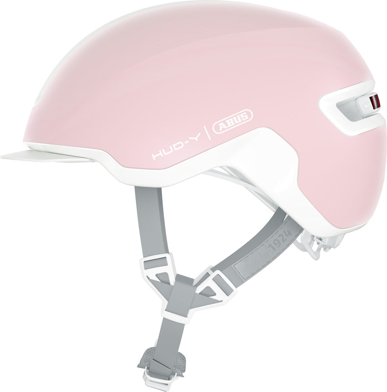Hjelm Hud-Y Pure Rose: En elegant cykelhjelm i en blød rosa farve, der ligger på en hvid baggrund.
