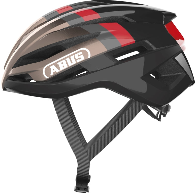 Cykelhjelm Abus StormChaser i metallic kobber, set fra siden med aerodynamisk design og justerbar pasform.