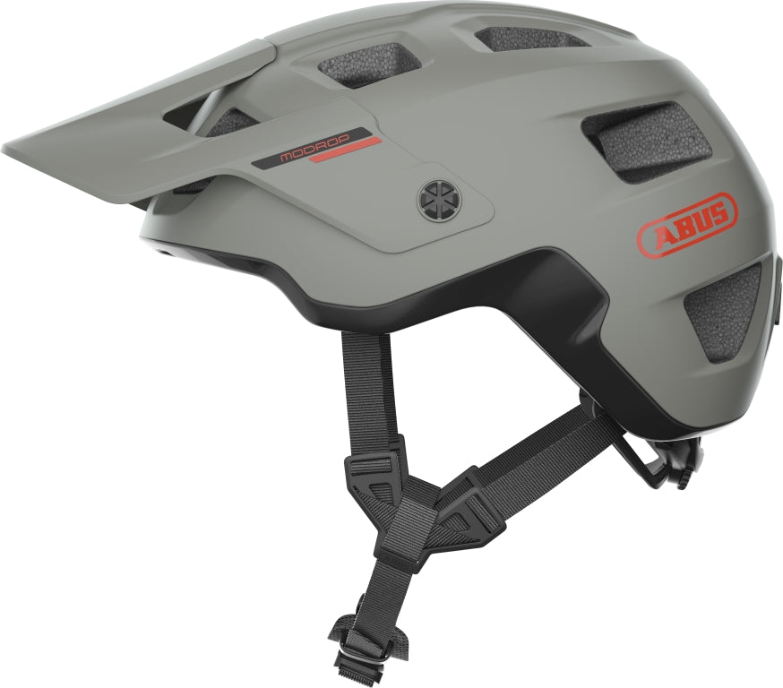 Cykelhjelm Abus Modrop Chalk Grey: En stilfuld, grå cykelhjelm med moderne design og ventilationsåbninger.