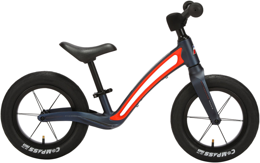 Matblå Motobecane Roadie Lobecykel med hvidt design, set fra siden, fremhæver cyklens elegante linjer.