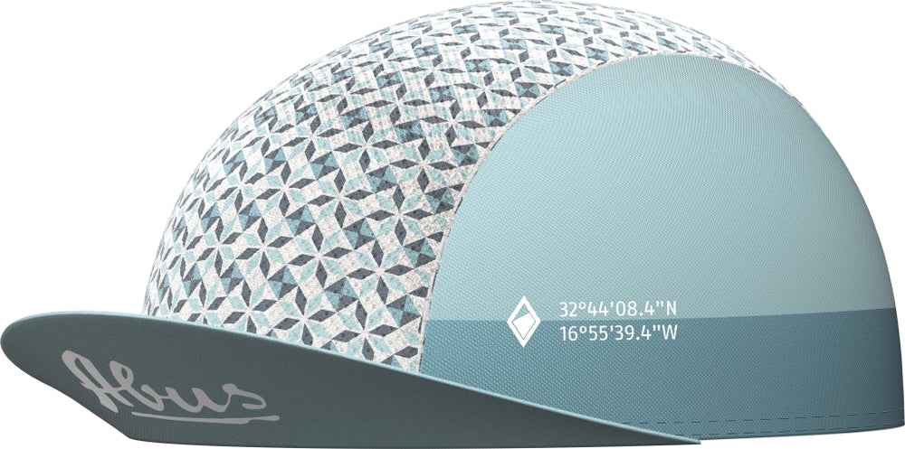 Race Cap Porto Blue: En blå cykelkasket med hvidt logo, designet til cykelryttere for stil og funktionalitet.