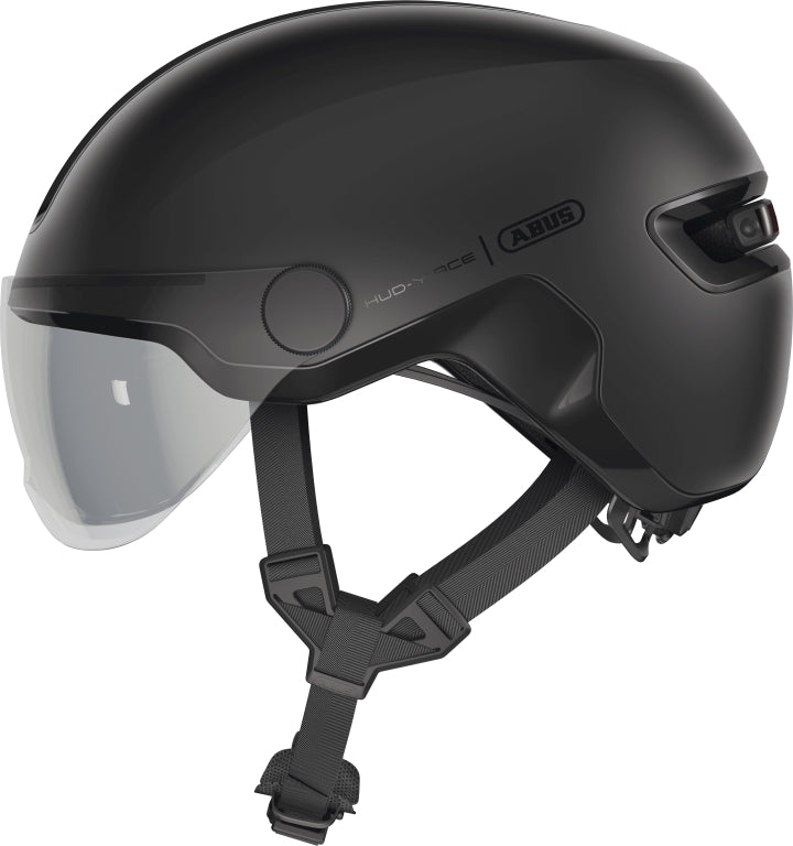 Cykelhjelm Abus Hud-Y Ace Velvet Black på en hvid baggrund, viser hjelmens elegante sorte design.