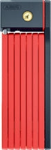 Rød Abus Foldelås 5700 Bordo uGrip SH 80cm foldet sammen på en cykelramme.
