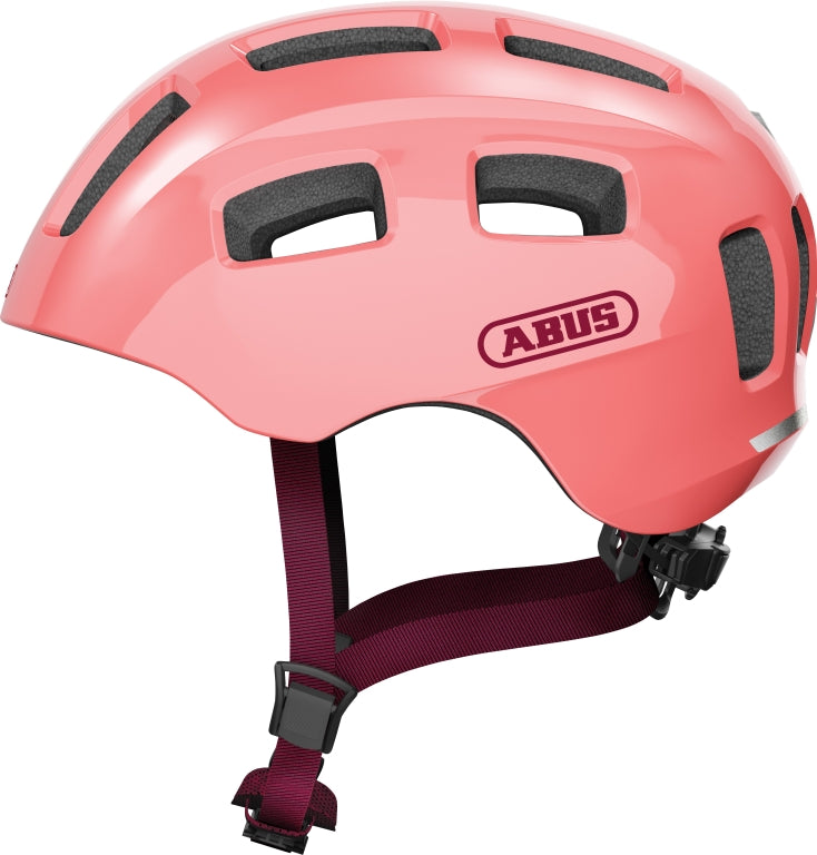 Cykelhjelm Abus Youn-I 2.0 Living Coral, en moderne og stilfuld hjelm i koralfarve, perfekt til cyklister.