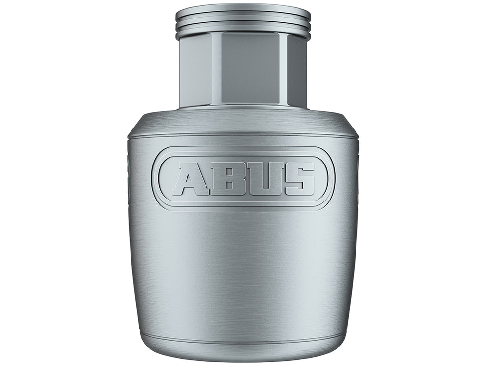 "Abus NutFix 3/8 Bolt" cykellås i sølv, der sikrer hjulene mod tyveri, monteret på en cykel i et bymiljø.