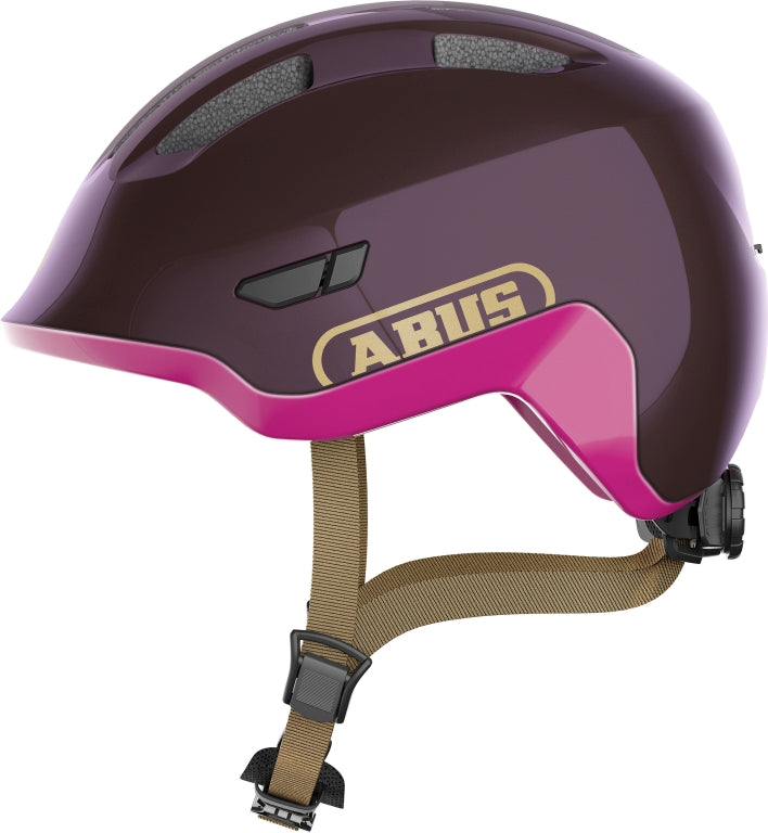 Cykelhjelm Abus Smiley 3.0 ACE LED Royal Purple, en lilla cykelhjelm med LED-lys og justerbar rem.