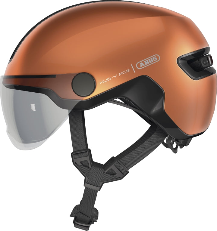 Cykelhjelm Abus Hud-Y Ace Goldfish Orange, en orange cykelhjelm med moderne design og ventilationshuller.