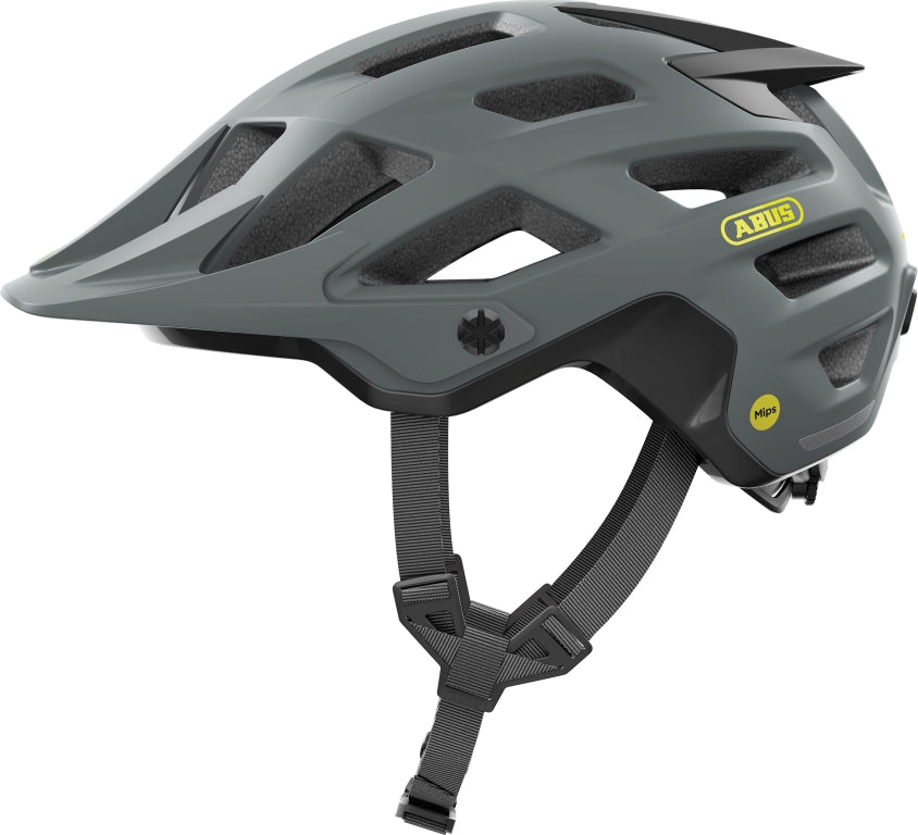 Cykelhjelm Abus Moventor 2.0 MIPS i beton grå farve, set fra siden med justerbar rem og ventilationshuller.