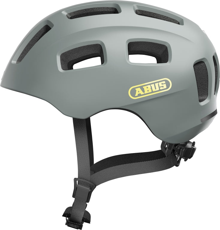 Cykelhjelm Abus Youn-I 2.0 i rød farve, set fra siden med justerbar rem og ventilationshuller.