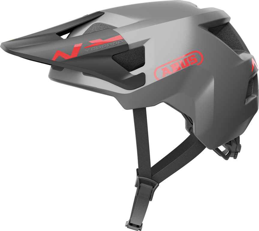 Sølvfarvet YouDrop TI cykelhjelm med aerodynamisk design og justerbar rem, perfekt til cykelentusiaster.