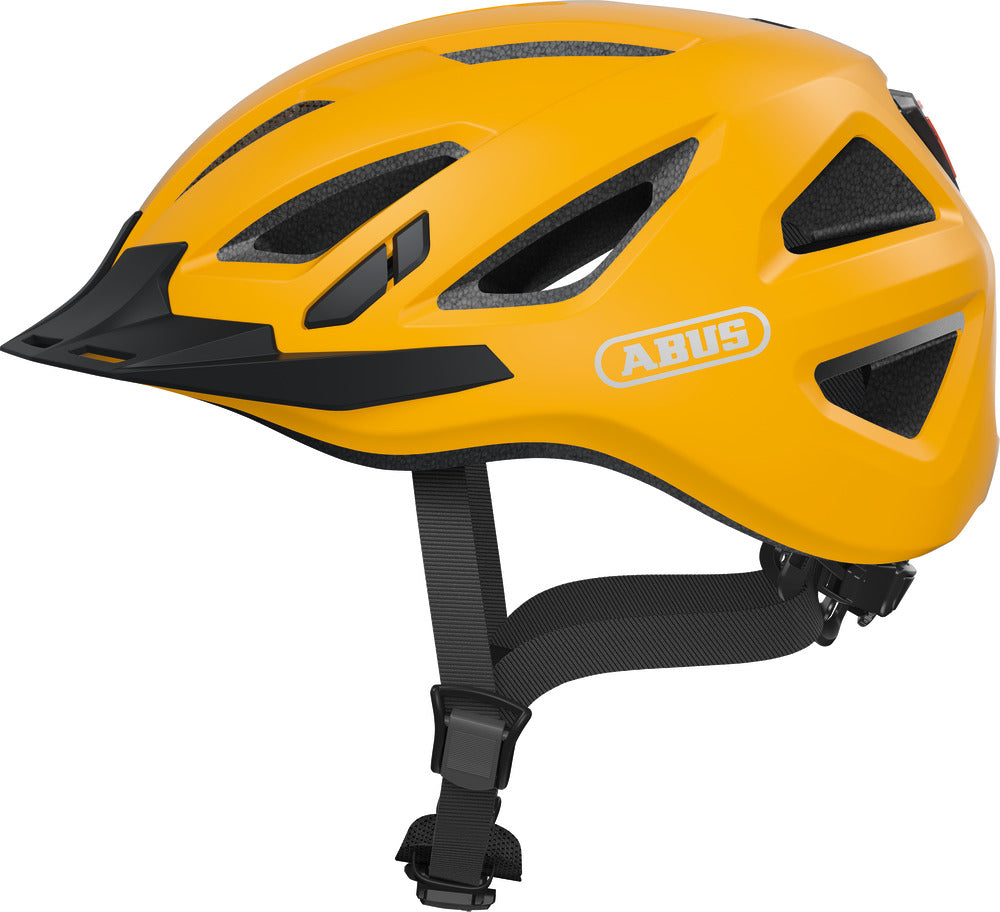 Cykelhjelm Abus Urban-I 3.0 i farven Icon Yellow, set fra siden, med et moderne og stilrent design.
