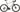 Cykel Principia Gravel 22Titan SRAM Force AXS Titanium HiRide i skovmiljø, set fra siden med grusvej i baggrunden.